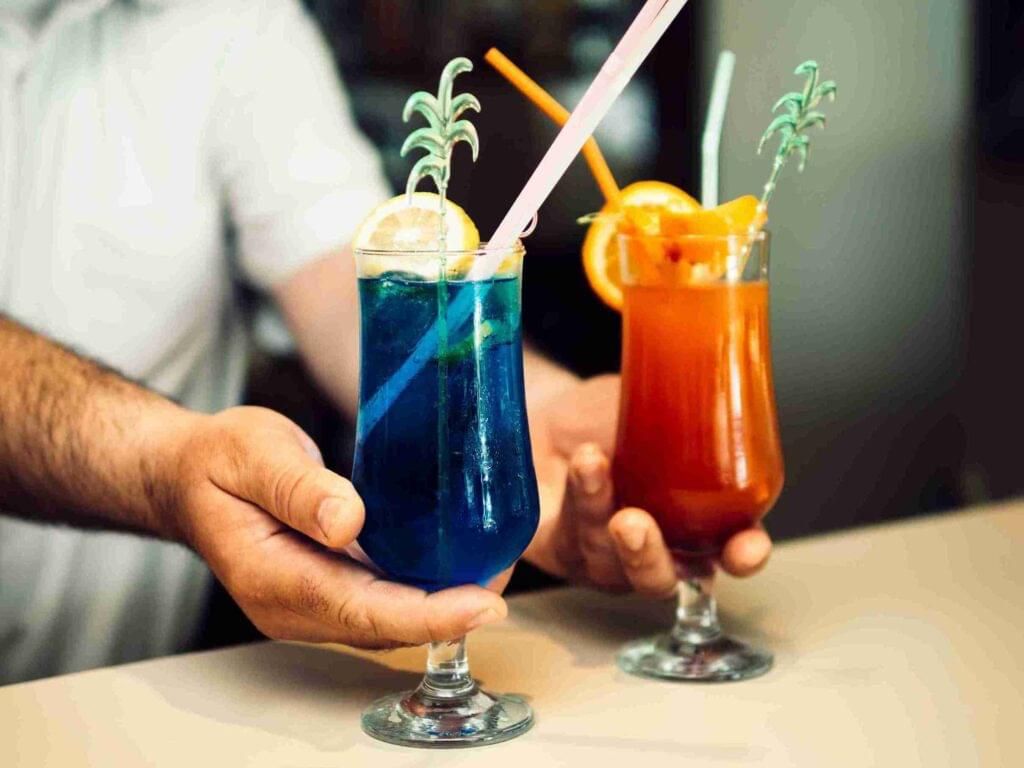 two glass of simple drinks mingle mocktail recipes in human hands